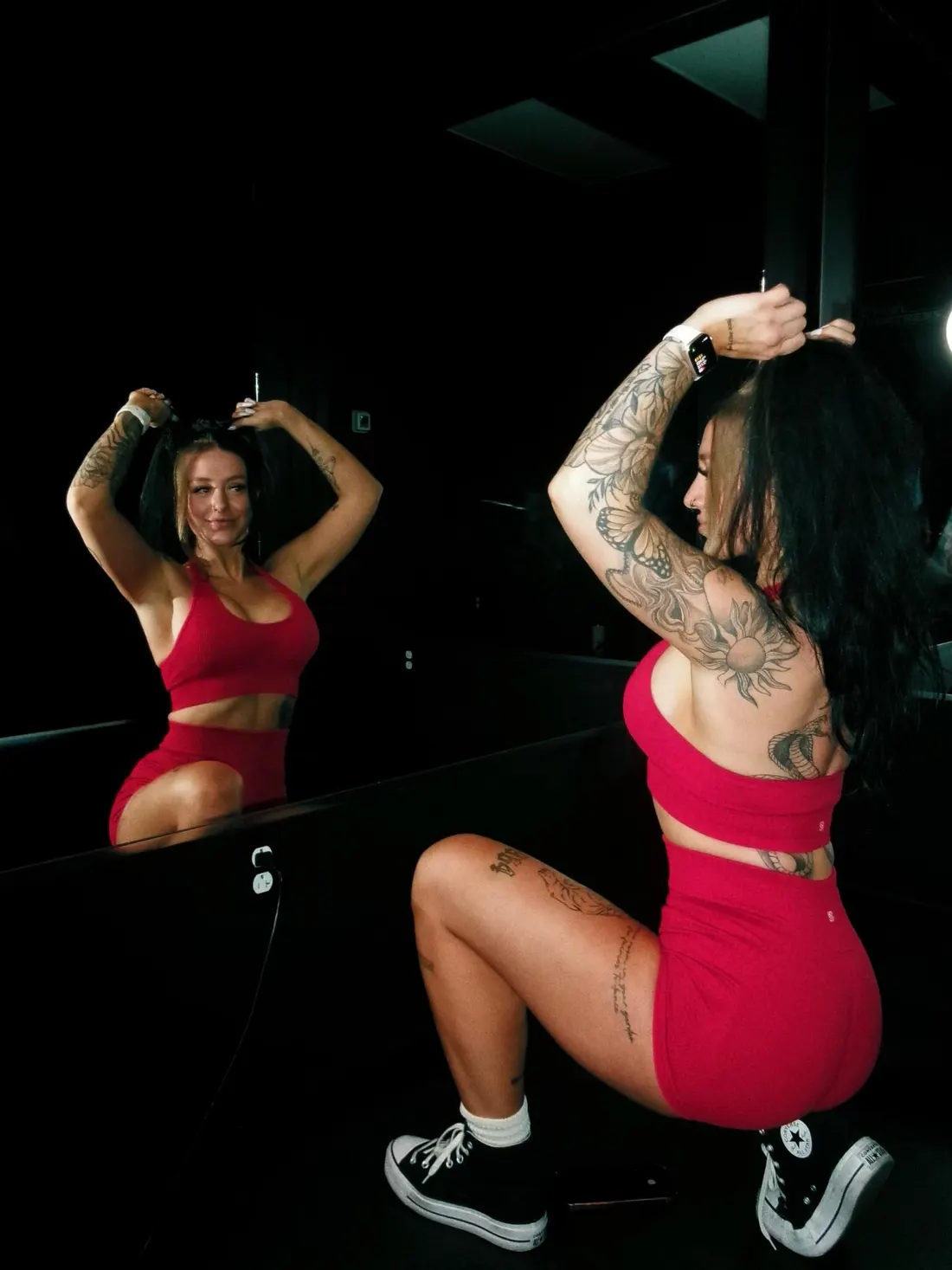 Shannon in a red set at the Fuel Fortress mirror